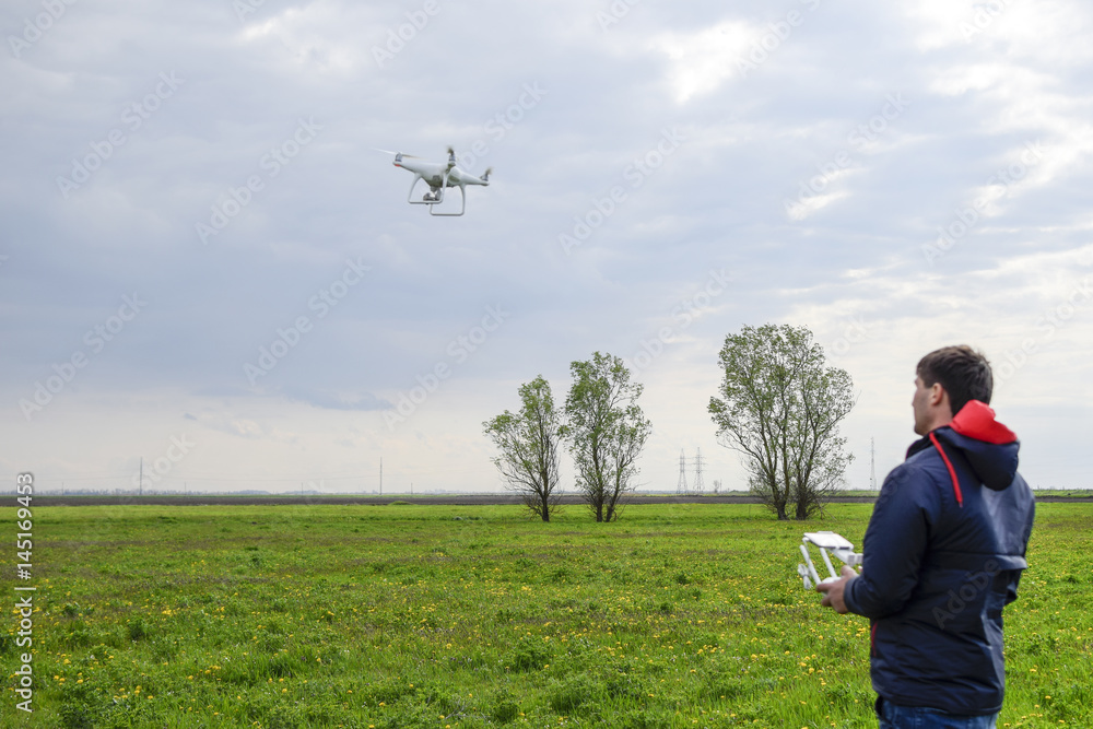 custom made wallpaper toronto digitalA man with a remote control in his hands. Flight control of the drone. Phantom