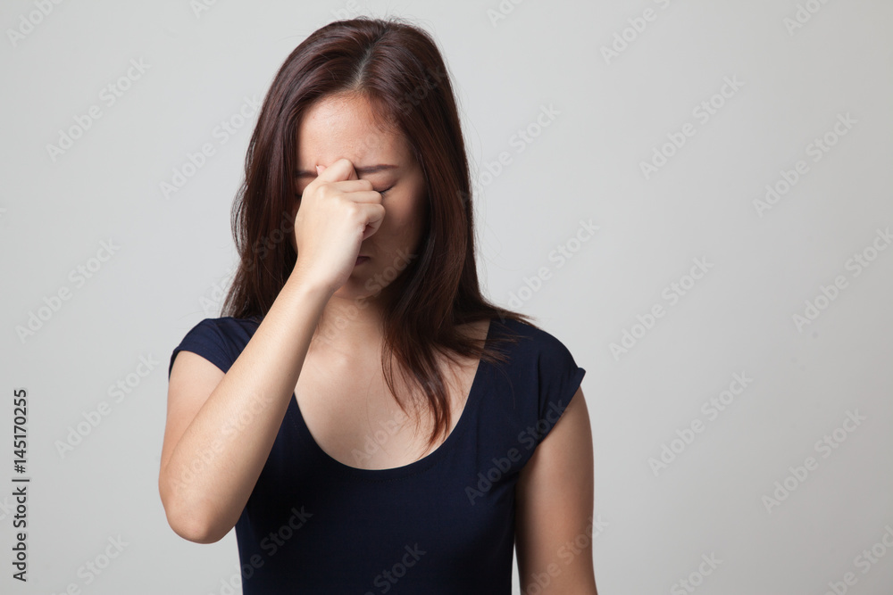 Young Asian woman got sick and  headache.