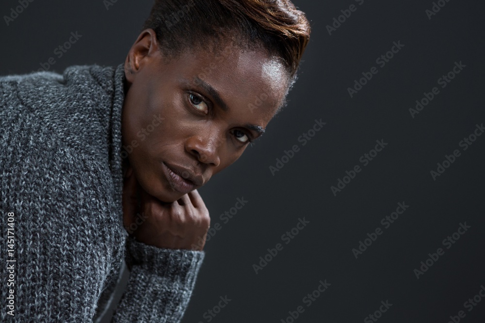 Androgynous man posing with hand on his chin Androgynous man posing with hand on his chin