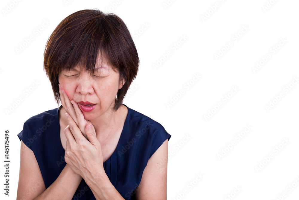 Asian woman suffering intense toothache pain with hands over face Asian woman suffering intense toothache pain with hands over face