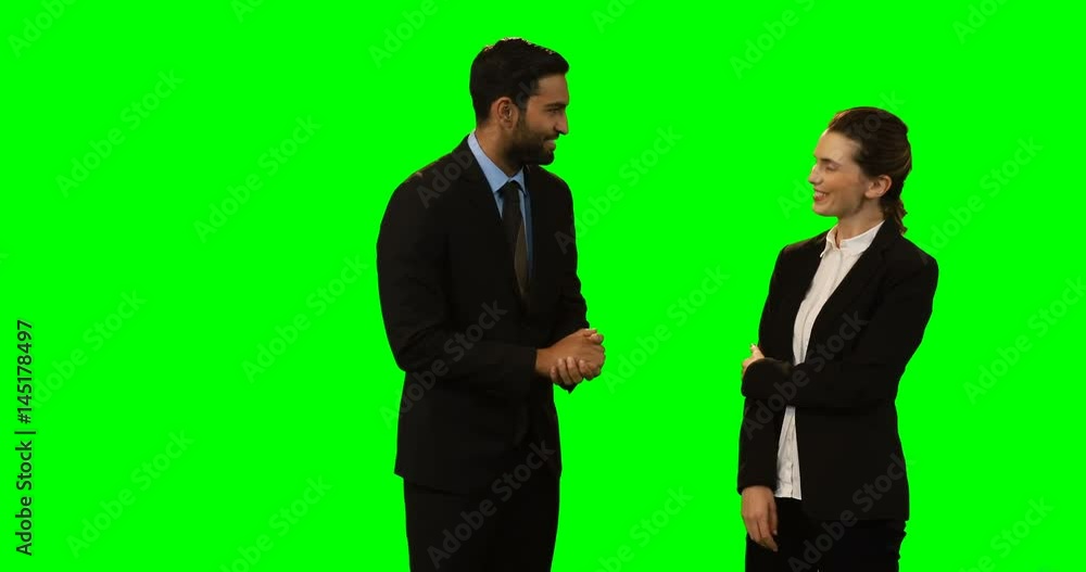 Businessman and colleague interacting with each other Businessman and colleague interacting with each other