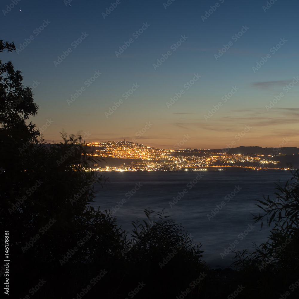 Obraz premium Night view of Tiberias from the opposite shore of Kinneret Lake