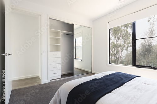 Mirrored wardrobe detail in a bedroom with a view