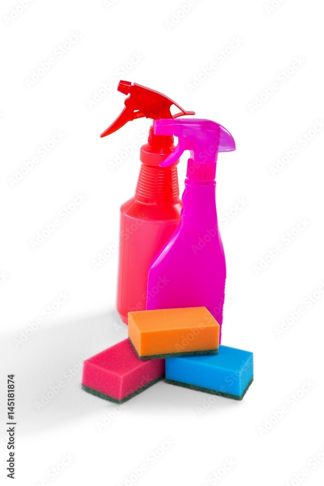 Colorful spray bottles and cleaning sponges Colorful spray bottles and cleaning sponges