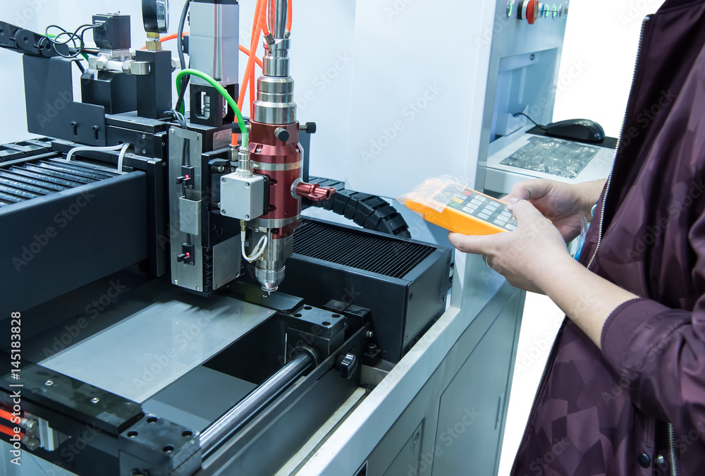 hand holding smart pannel to control Laser cutting of metal sheet, 3D rendering hand holding smart pannel to control Laser cutting of metal sheet, 3D rendering