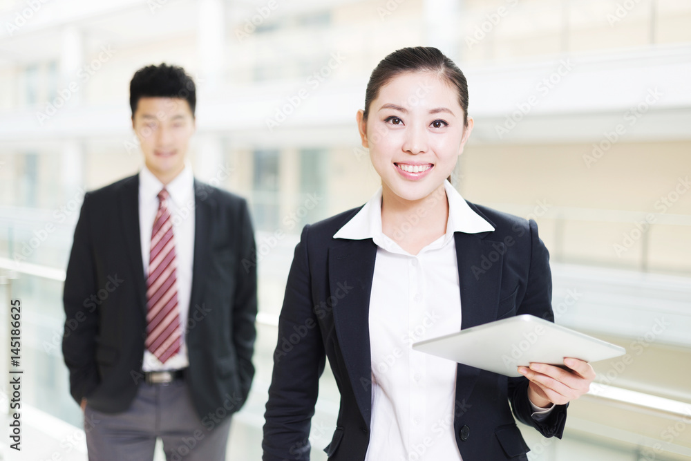 young asian businessman and businesswoman in modern office