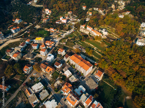 The central part of the modern town of Budva with hotels and high-rise buildings. Aerial view. Europe