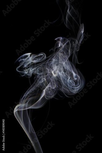 Fototapeta Naklejka Na Ścianę i Meble -  Abstract white blue smoke from aromatic sticks.