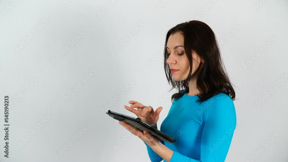 Woman wearing sunglasses, using digital tablet and chatting with someone. White background. Woman wearing sunglasses, using digital tablet and chatting with someone. White background.