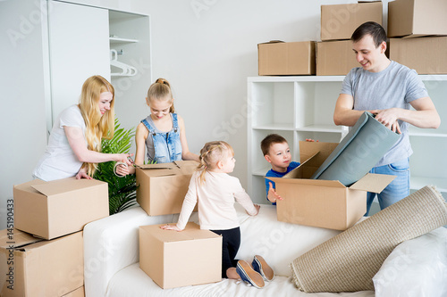 Family packing cardboard boxes