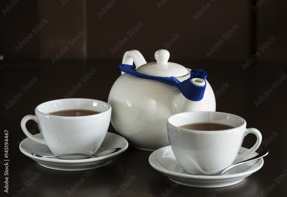 Two white cups with tea Two white cups with tea