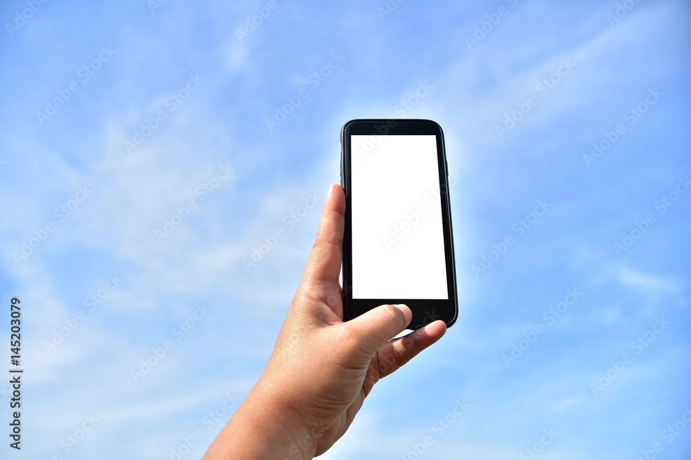 hand holding smartphone with nature background. hand holding smartphone with nature background.