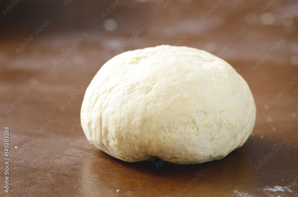 Fresh bread dough prepare for baking on wooden board Fresh bread dough prepare for baking on wooden board