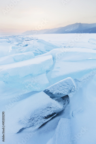 Turquoise ice floes. Winter sunset landscape