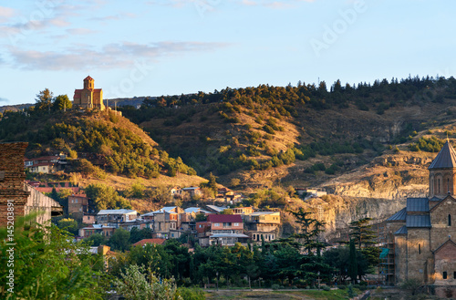 фотографія View of old city and Tabor Monastery at sunset. Tbilisi, Georgia