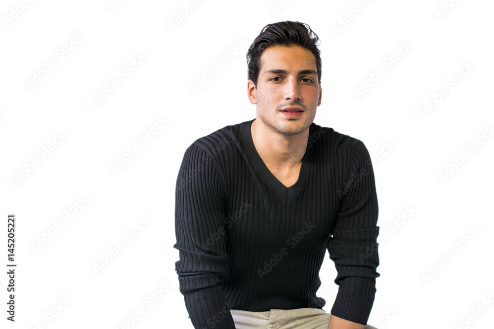 Brown eyed, black haired latin man standing in studio, looking at camera, isolated on white background Brown eyed, black haired latin man standing in studio, looking at camera, isolated on white background