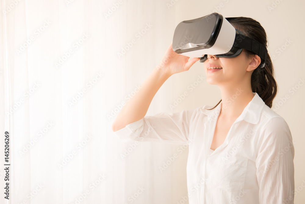 Woman wearing virtual reality goggles Woman wearing virtual reality goggles