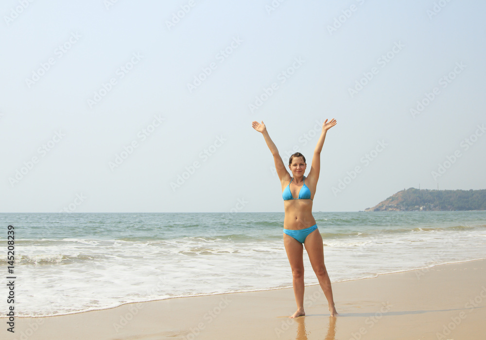 Beauty woman relaxing on the tropical beach Beauty woman relaxing on the tropical beach