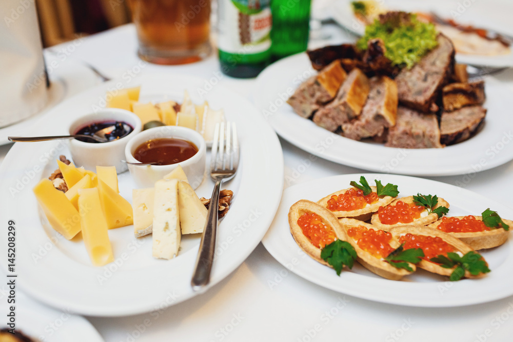 Cheese served on plate with sauces