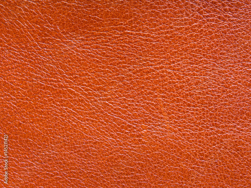 Background, texture of a red leather old material with embossed and patterned vintage eco style