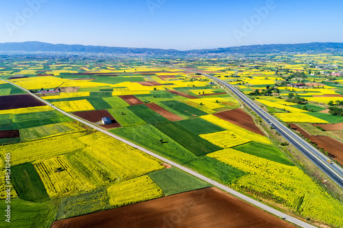Aerial view of road passing through a rural landscape with blooming in northern Greece