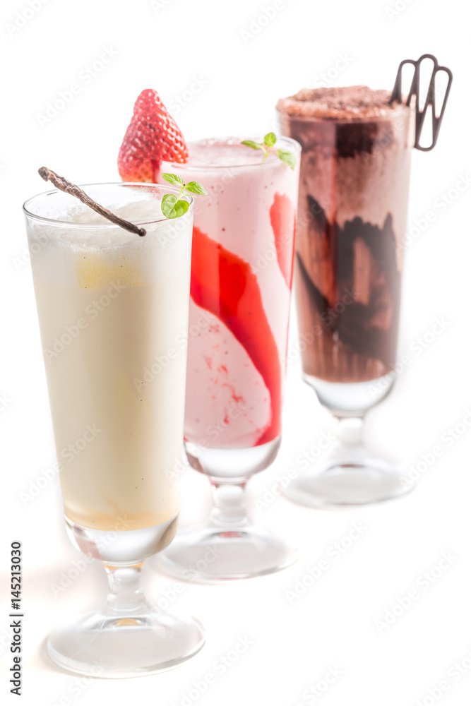 Strawberry, chocolate and vanilla smoothies on white background Strawberry, chocolate and vanilla smoothies on white background
