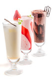 Strawberry, chocolate and vanilla smoothies on white background