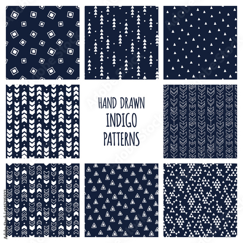 Set of hand drawn indigo blue and white patterns. Seamless vector triblal aztec backgrounds with triangles and arrows.