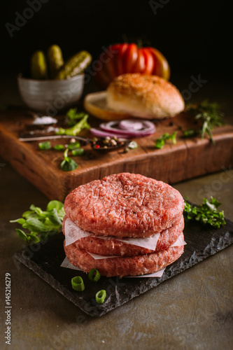 Raw ingredients for a gourmet burger photo