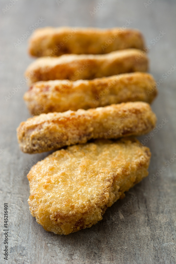 Fried chicken nuggets on wooden table
Fried chicken nuggets on wooden table