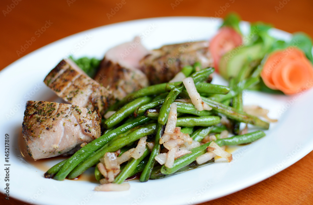 Steak with herbs on a plate in the pub. Steak with herbs on a plate in the pub.