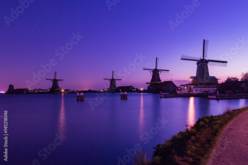 Traditional Dutch windmills in Zaanse Schans in sunrise time, Amsterdam area, Holland