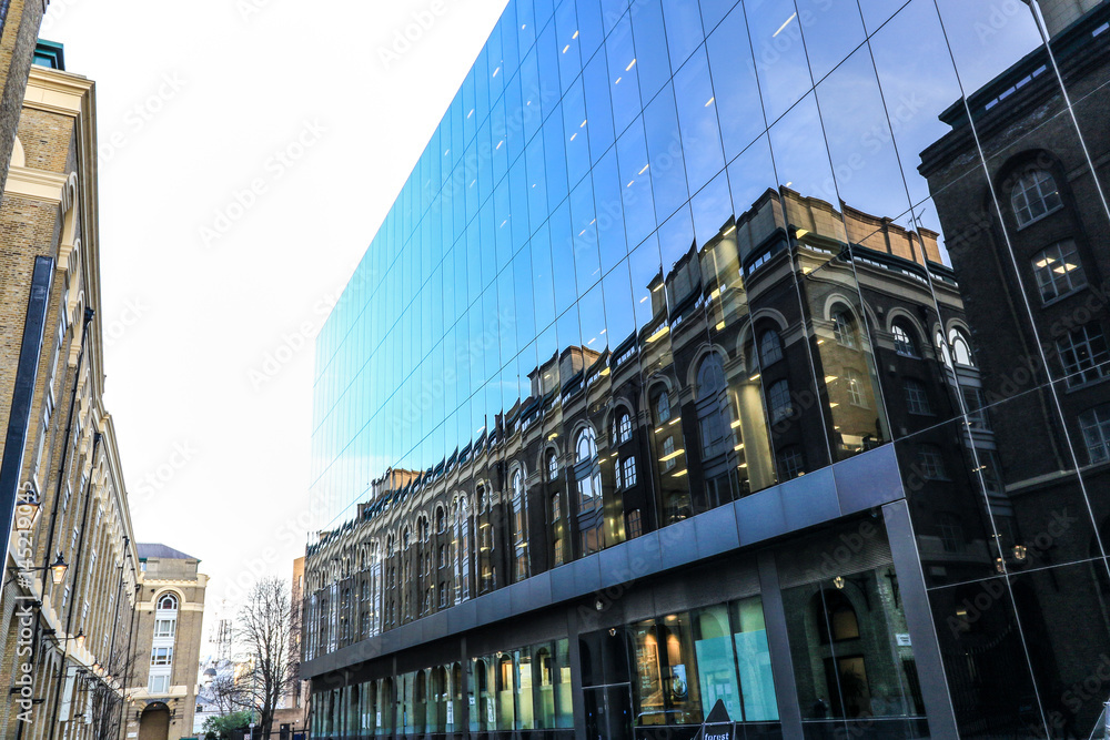 Naklejka premium Reflections of houses in office