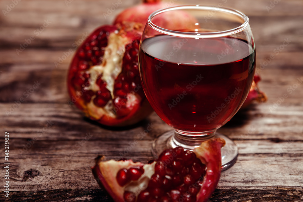 Close shot of glass with pomegranate juice Close shot of glass with pomegranate juice
