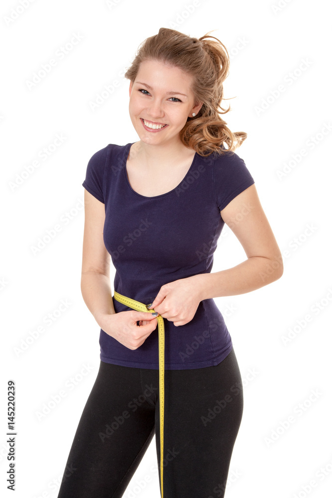 Young woman in sports wear holding measuring tape Young woman in sports wear holding measuring tape