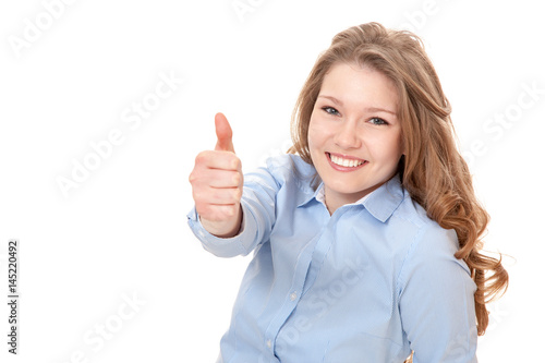 Young woman showing thumbs up