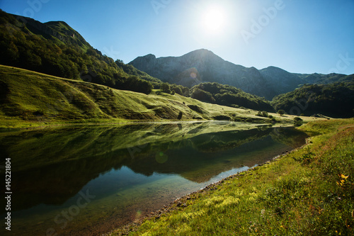 High mountains landscape - mountain lake and forest