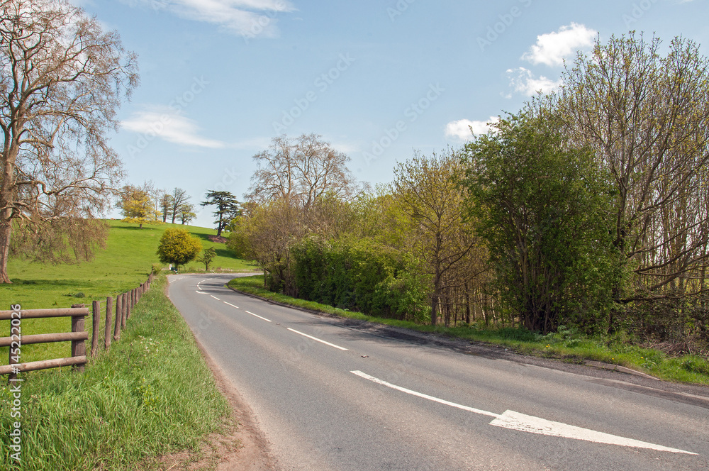 Summertime country road scenery in the Herefordshire countryside of the United Kingdom,