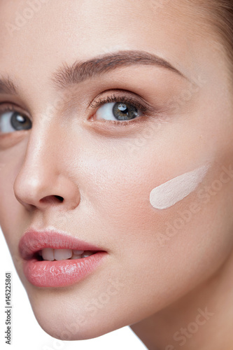 Skin Care. Sexy Girl With Liquid Foundation Stripe On Face