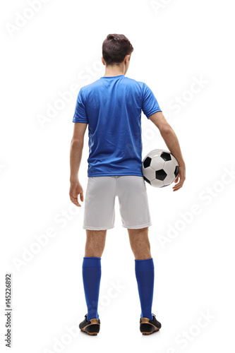 Rear view shot of a teenage football player