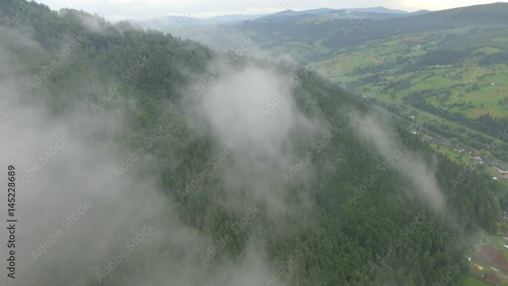 Drone Flying In The Clouds Above A Mountain Village Drone Flying In The Clouds Above A Mountain Village