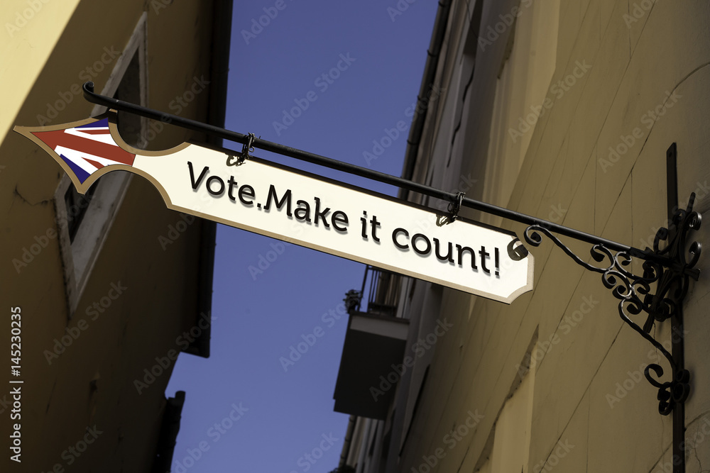 Directional street sign.  Presidential, parliamentary election day concept. Direction to the polling place. Vote.Make it count. - United Kingdom, Britain elections.2017