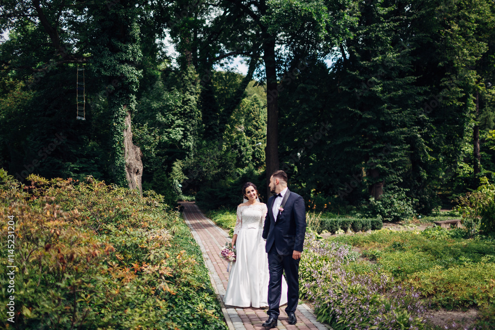 Fototapeta premium The lovely couple in love walking along park