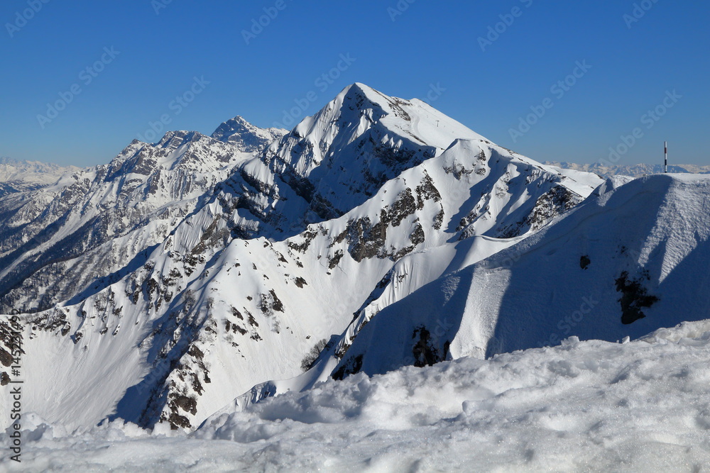 Snow-covered mountains. Ski Resort Rosa Khutor. Russia.
