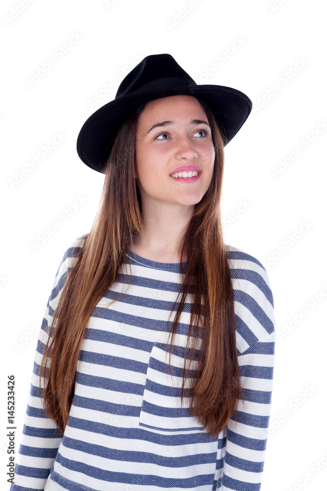 Pretty teenager girl with black hat posing at studio.