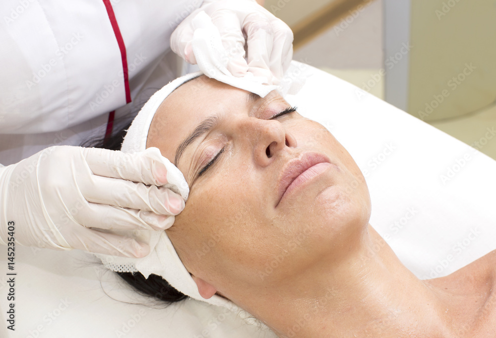 Process cosmetic mask of massage and facials in beauty salon 