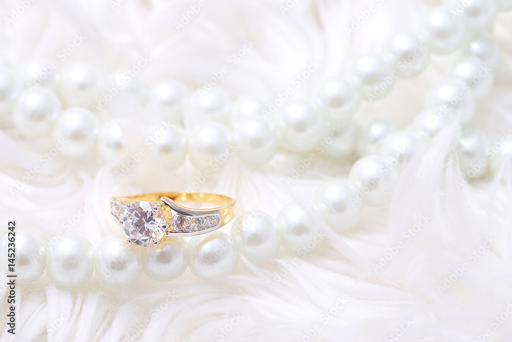 Golden ring with diamond and pearl Golden ring with diamond and pearl
