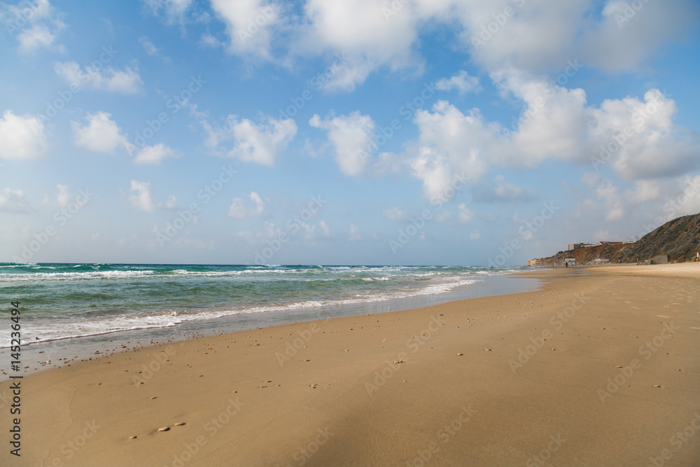 Empty beach with beautiful cloudy sky. Tourism and vacation concept. Empty beach with beautiful cloudy sky. Tourism and vacation concept.