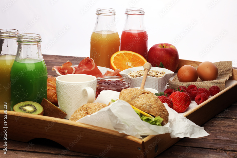 breakfast on table with bread rolls, croissants, coffe and juice breakfast on table with bread rolls, croissants, coffe and juice