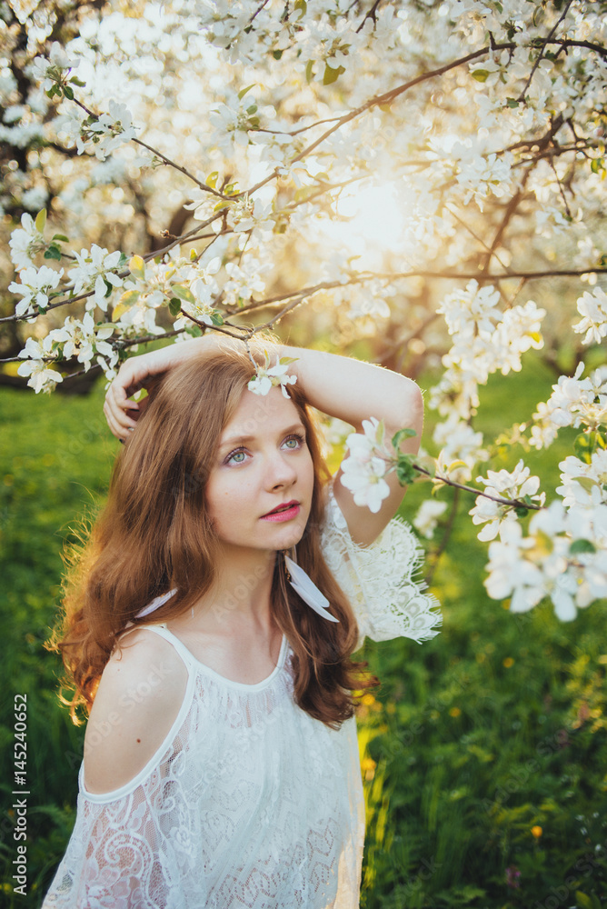  A girl in a blooming garden